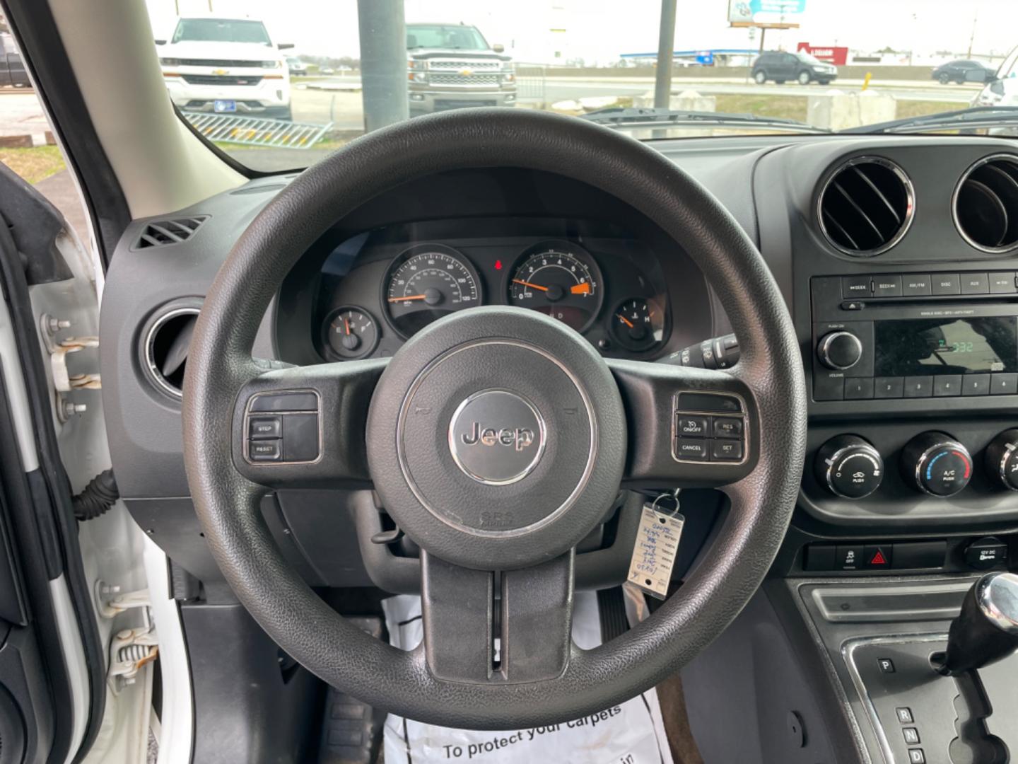 2014 White Jeep Patriot (1C4NJPBAXED) with an 4-Cyl, 2.0 Liter engine, Automatic, 6-Spd w/AutoStick transmission, located at 8008 Warden Rd, Sherwood, AR, 72120, (501) 801-6100, 34.830078, -92.186684 - Photo#14